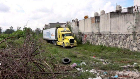Dan sepultura a 19 cuerpos del tráiler en Jalisco